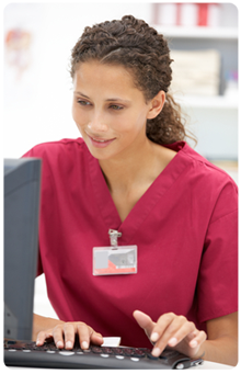 Nurse inputting data into computer