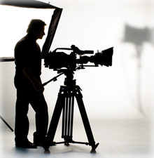 Silhouette of a man with a video camera