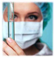 Woman inspecting a glass vial