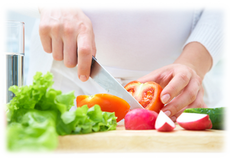 Person slicing a tomato