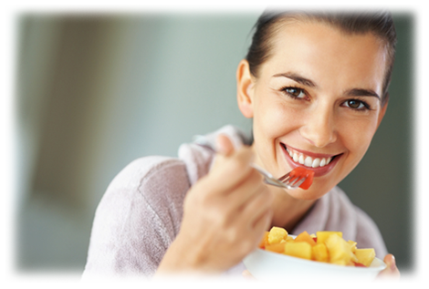 Woman eating fruit salad